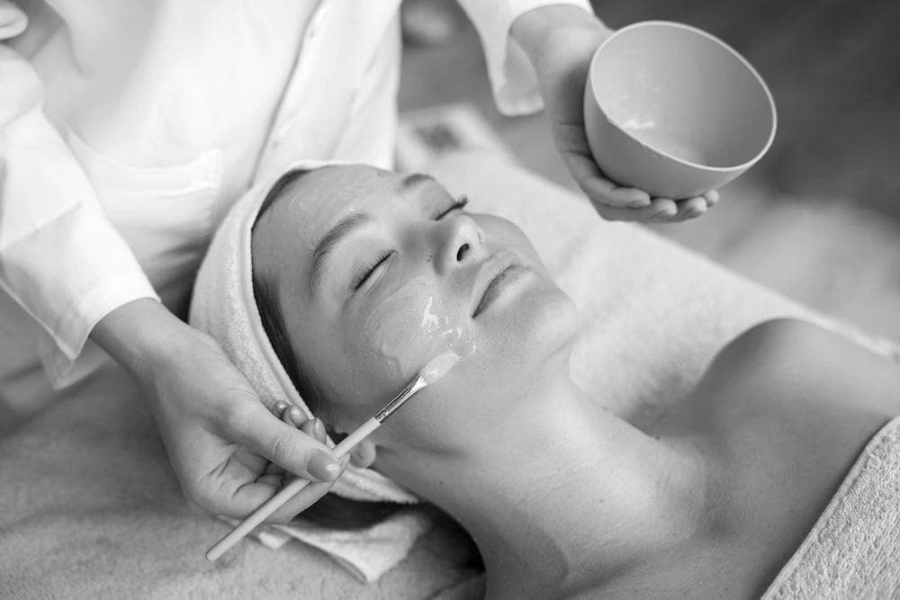 A woman receiving chemical peel treatment