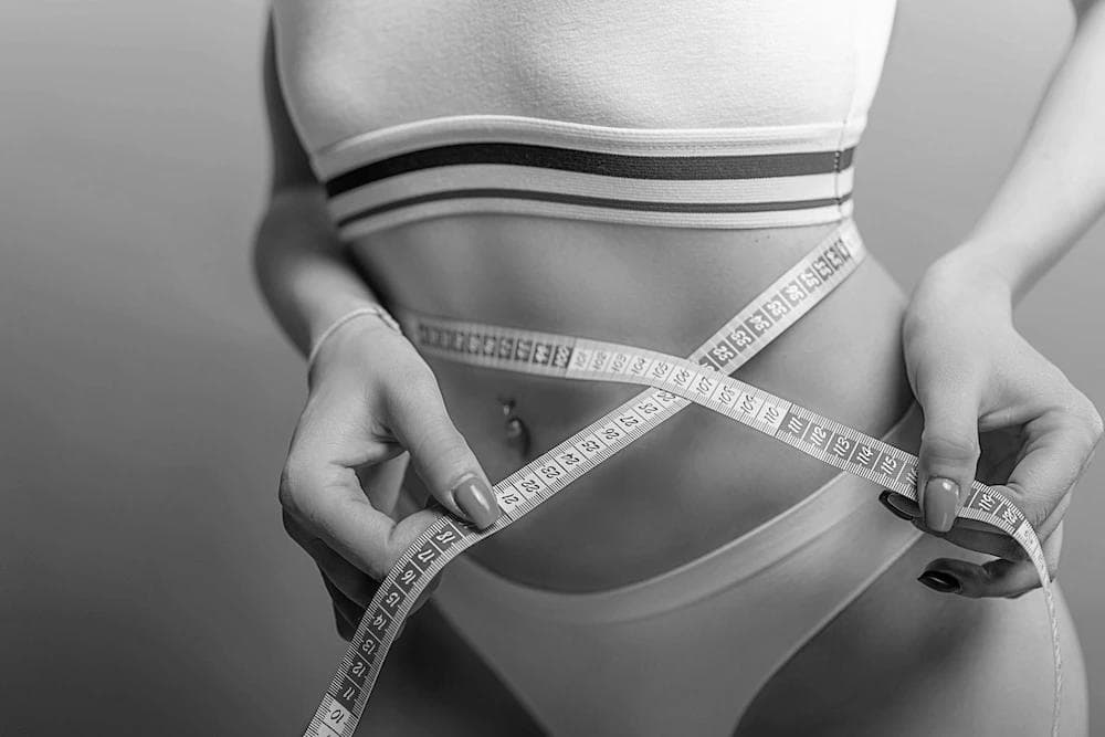 A woman who's showing positive results from Atelier Aesthetics weight loss program